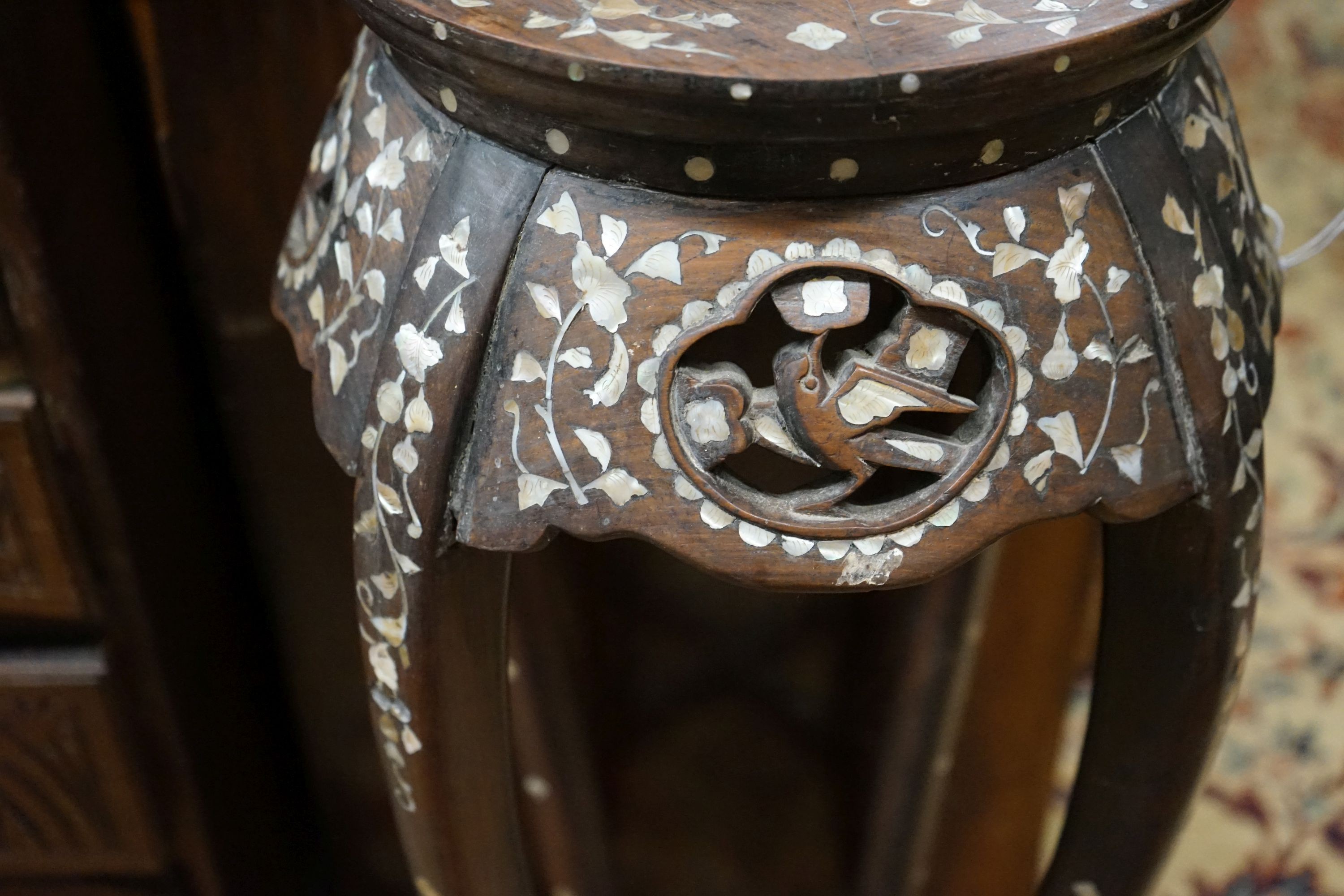 A pair of Chinese mother of pearl inset hardwood vase stands, height 92cm